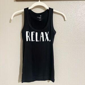 Ribbed Tank with “Relax” written on it.